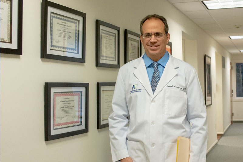 Dr. Joseph Amalfitano Walking Through The Main Hallway In Amalfitano Center for Dental Implants and Periodontics