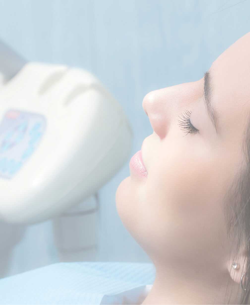 Very nice lady with dark hair asleep in dental chair